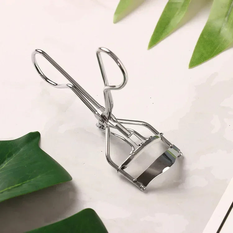 Multicolor woman eyelash curler from HSF Marketplace, professional makeup tool for curling and lifting natural eyelashes.