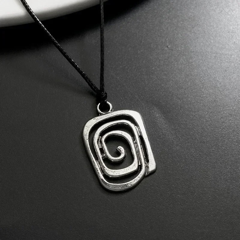 Vintage spiral vortex pendant necklace with hand-woven leather rope, boho goth jewelry for women.