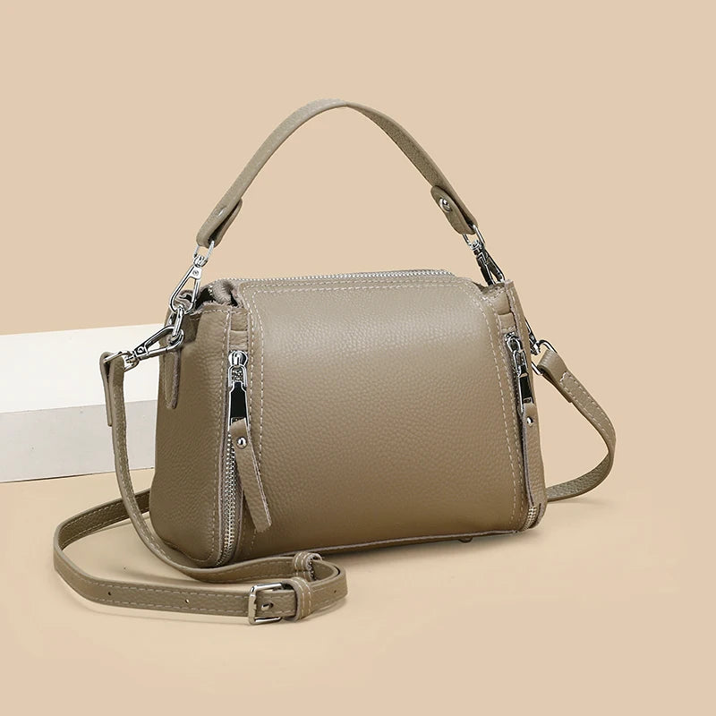 Luxury genuine leather messenger handbag for women, high-capacity cowhide crossbody bag with shoulder strap, travel and designer style.