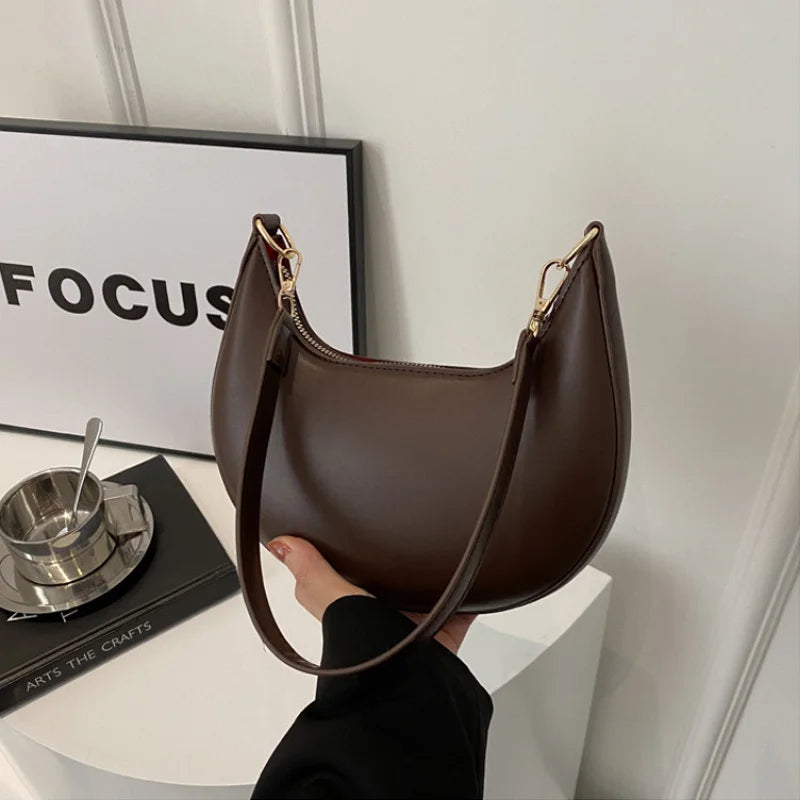 Luxury moon-shaped women's handbag by HSF Marketplace, stylish high-end shoulder bag with elegant design and spacious interior.