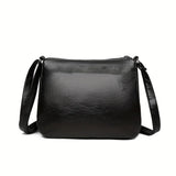 Black embossed PU leather women's crossbody handbag with multiple pockets, large capacity, ideal for outings and parties.