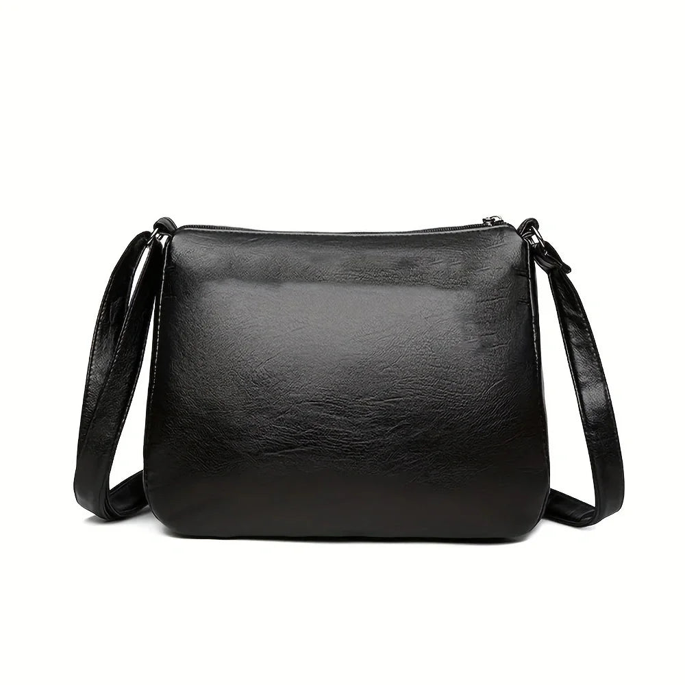 Black embossed PU leather women's crossbody handbag with multiple pockets, large capacity, ideal for outings and parties.
