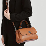 Luxury genuine leather women's crossbody handbag in a structured design with an adjustable shoulder strap