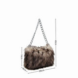 Luxury leopard print handbag by HSF Marketplace featuring a soft chain shoulder strap and spacious underarm design.