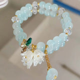 Colorful Lily Valley flower bracelet for women featuring crystal beads and elastic design, perfect for wedding or birthday jewelry.
