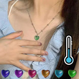 Thermochromic mood monitor heart pendant necklace by HSF Marketplace displaying color-changing feature, worn as jewelry for women and girls.
