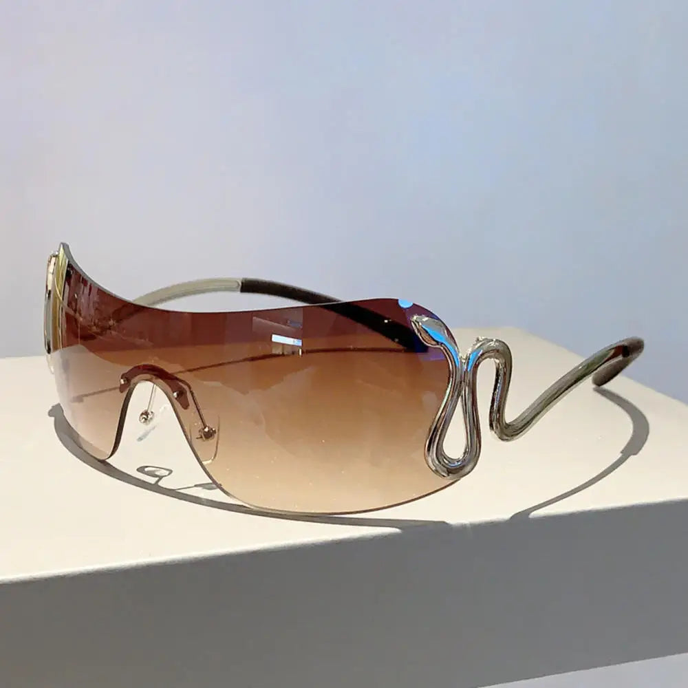 Y2K rimless sunglasses for women with snake ray metal legs, gradient lenses, wrap-around punk style, stylish luxury eyewear