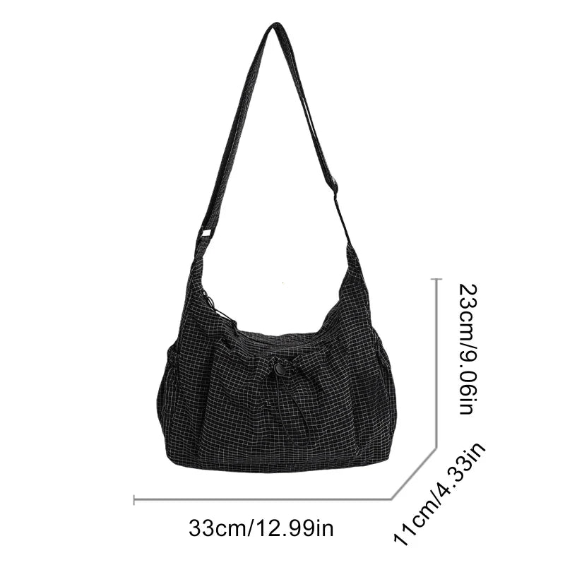 Women checkered nylon sling bag with drawstring, large capacity trendy crossbody handbag for shopping and casual outings.