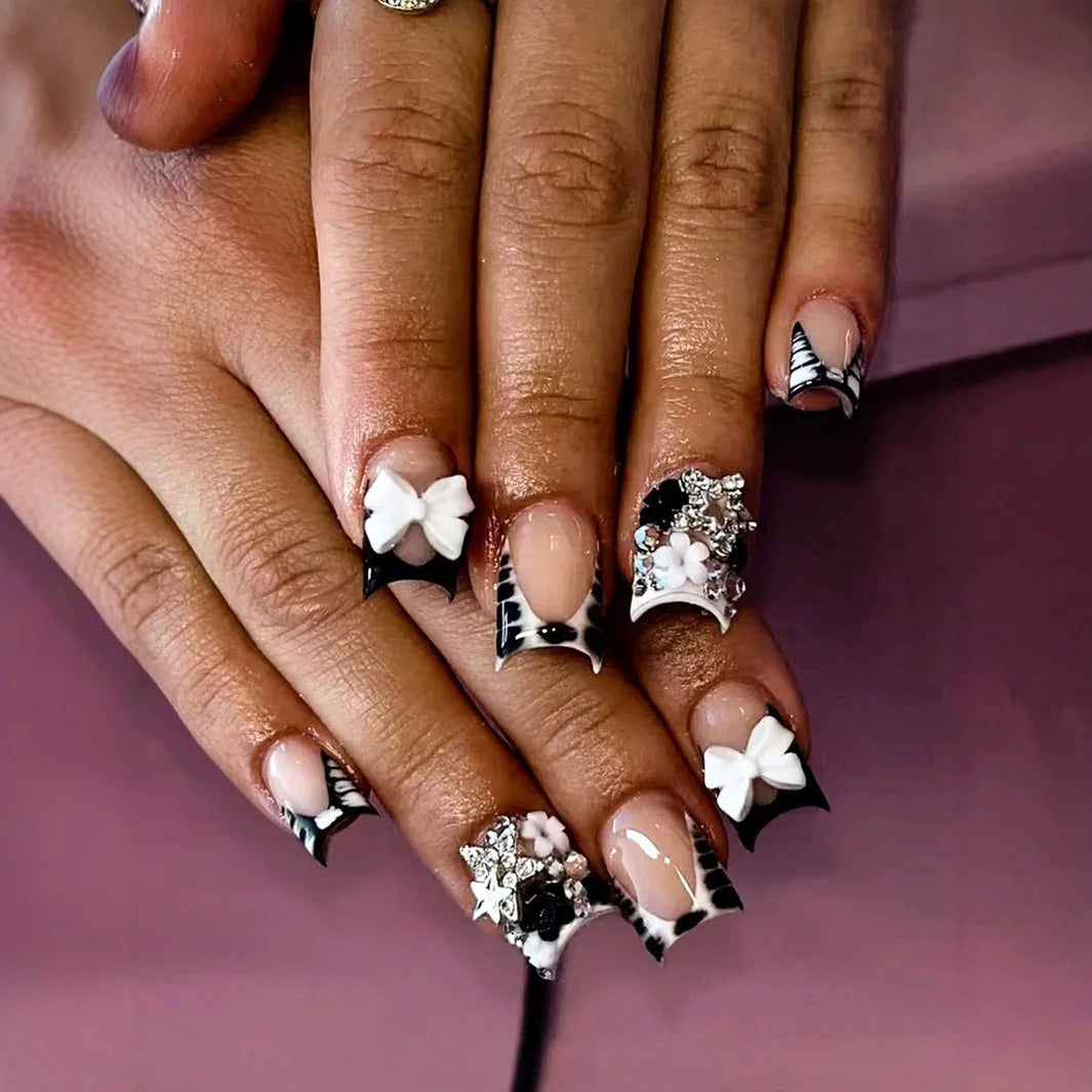 24-piece nude pink short duckbill false nails with leopard French tips, 3D bowknots, butterflies and cherries