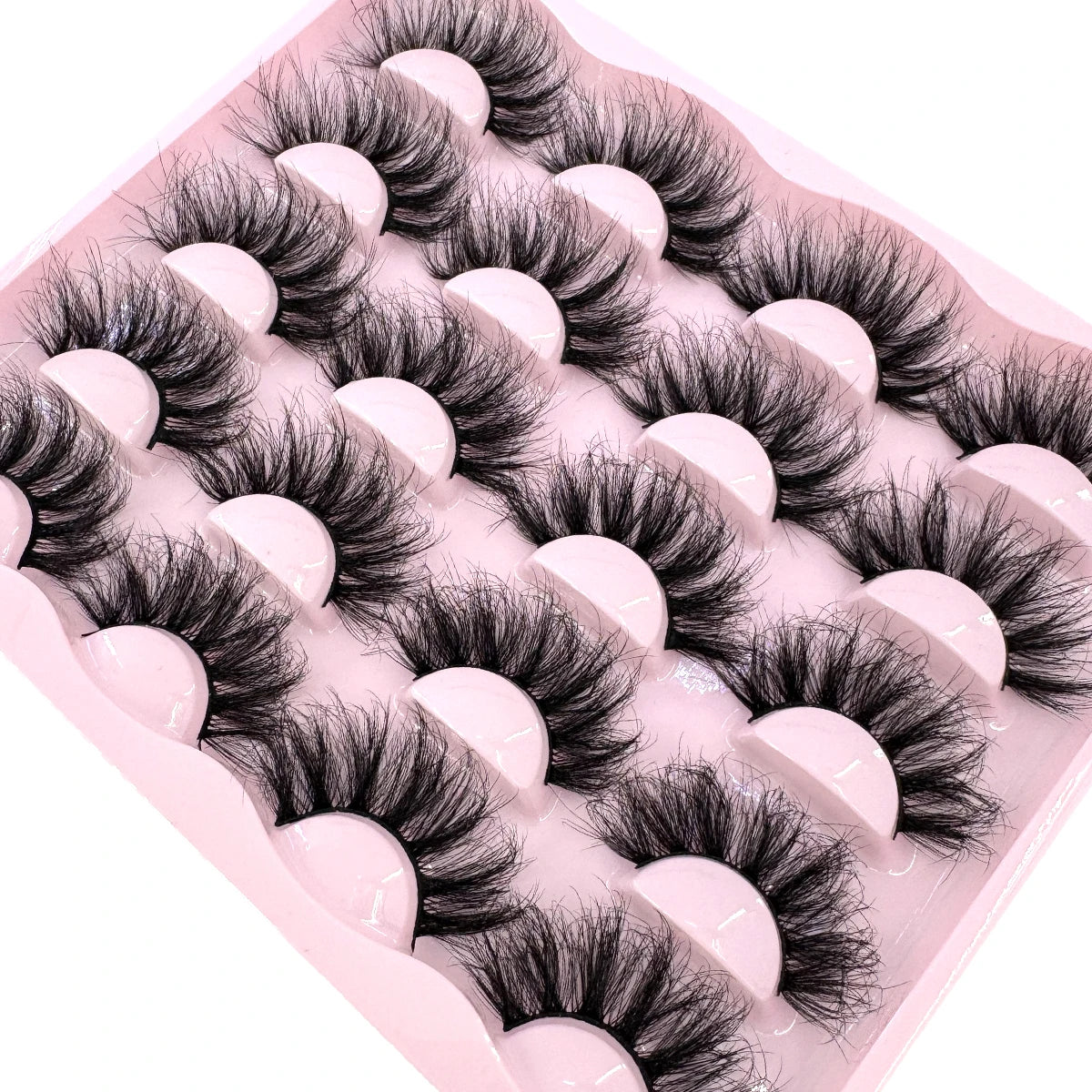 Set of 10 pairs of 25mm wispy, fluffy faux mink false eyelashes with dramatic volume and cat eye design for makeup.