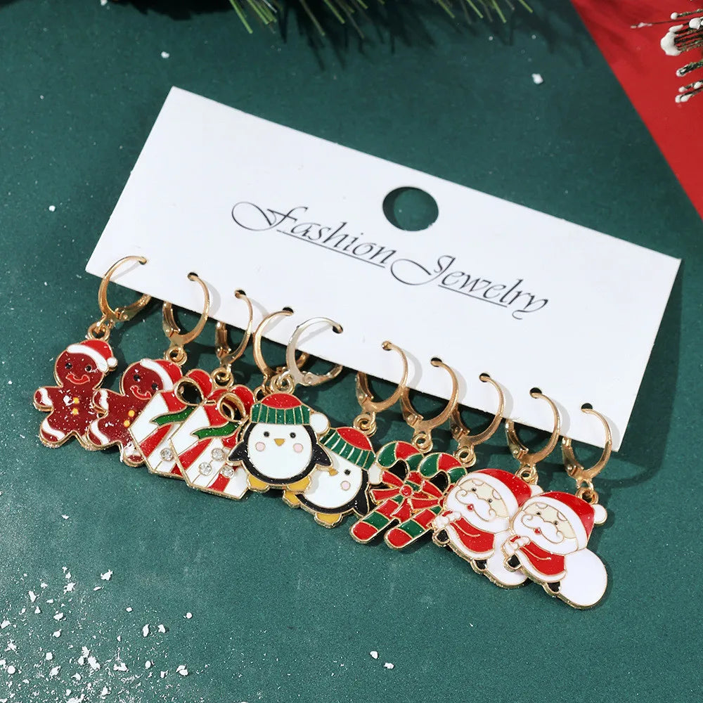 Festive Christmas dangle earrings by HSF Marketplace featuring snowman and elk designs