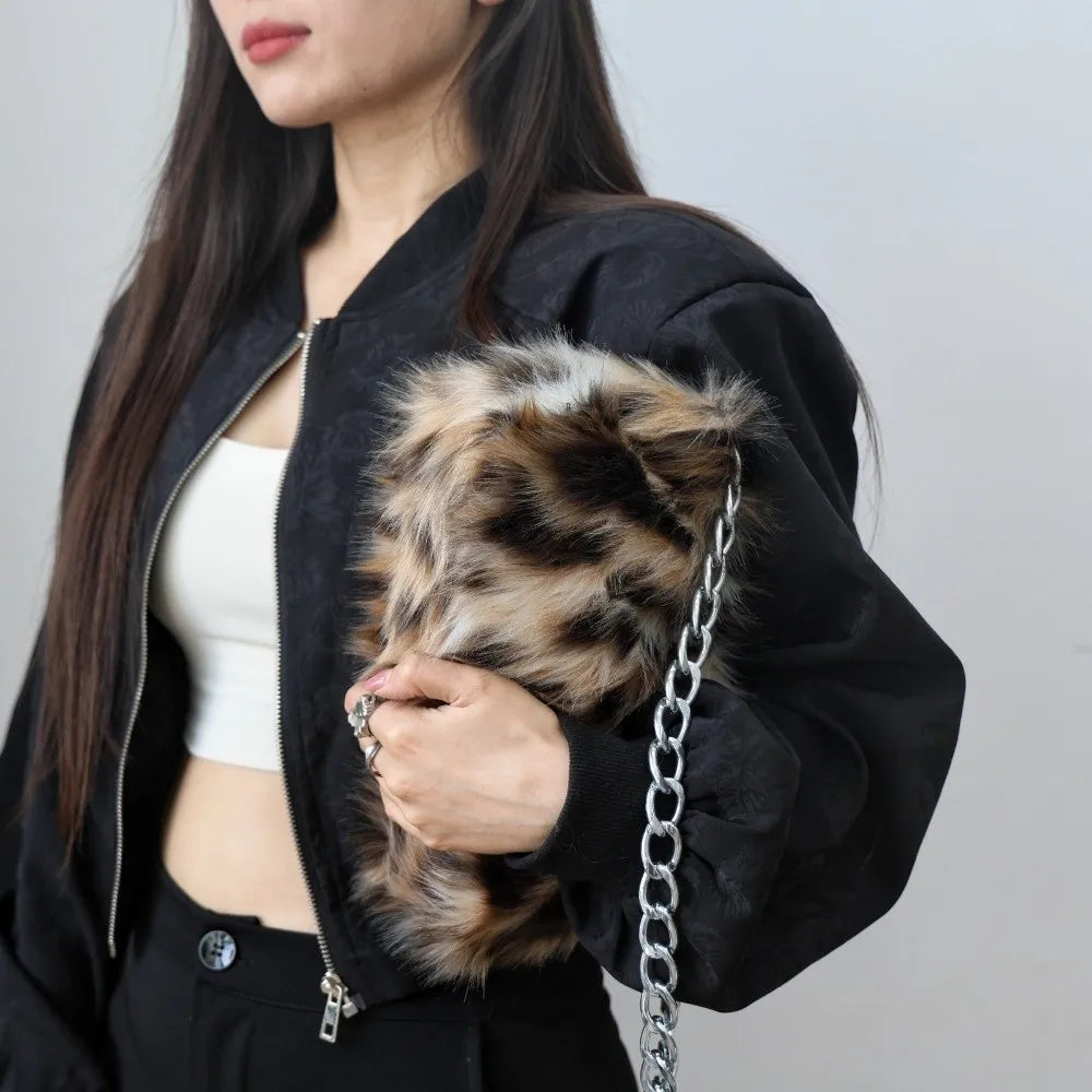 Luxury leopard print handbag by HSF Marketplace featuring soft chain shoulder strap and spacious underarm design for women.