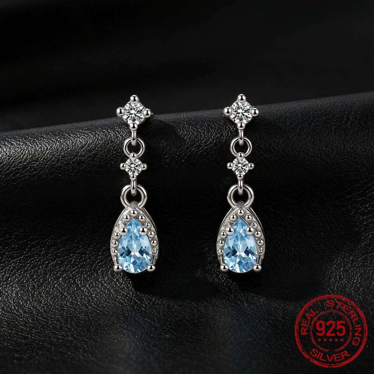 Sterling silver dangle drop earrings with sea blue CZ stones for women by HSF Marketplace