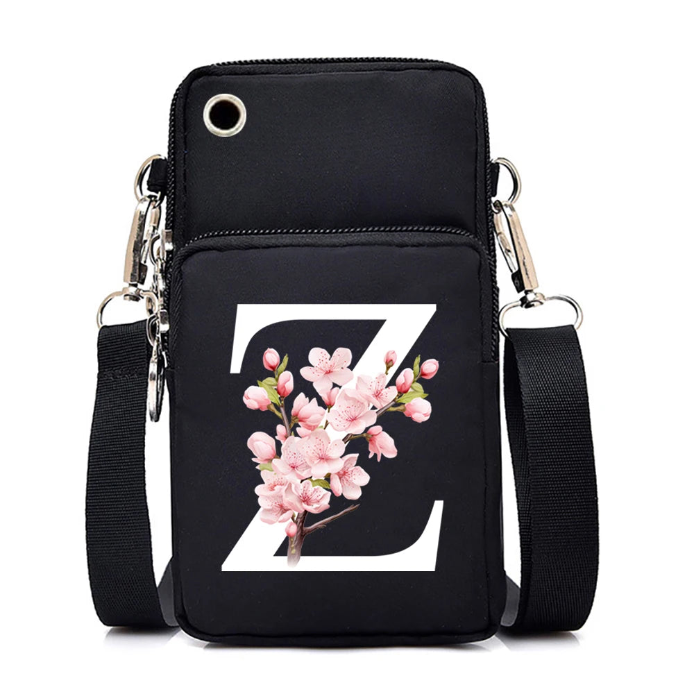 Small floral Sakura alphabet graphic crossbody bag for women, featuring letters, mobile phone pocket, and stylish messenger design.