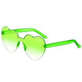 Pink love heart shaped sunglasses for women with a big vintage frame, UV400 protection, outdoor fashion eyewear by HSF Marketplace.