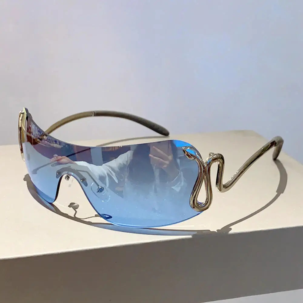 Y2K rimless sunglasses for women with snake ray metal legs, gradient lenses, wrap-around style, luxury fashion eyewear.
