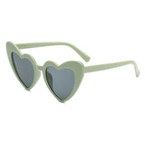 Pink heart-shaped retro sunglasses for girls, shiny transparent frames, perfect for beach parties and photos.