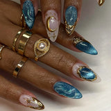 24-piece Y2K gradient blue French press-on false nails with gold moon and star designs, almond shape