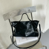 Luxury PU leather women's handbag with spacious design, shoulder strap, and stylish tote for office and commuting use.