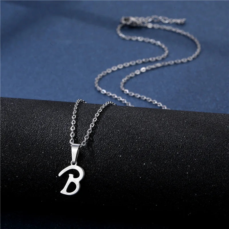 Shiny stainless steel initial letter pendant necklace for women with a simple clavicle chain choker jewelry.