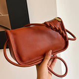 Genuine cowhide leather women's crossbody handbag with high capacity, stylish shoulder bag for ladies, featuring a sleek design.