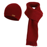Women's warm woolen hat, scarf, and gloves winter set in a coordinated design