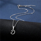 Shiny stainless steel initial letter pendant necklace for women, featuring a simple glossy design on a delicate clavicle chain.