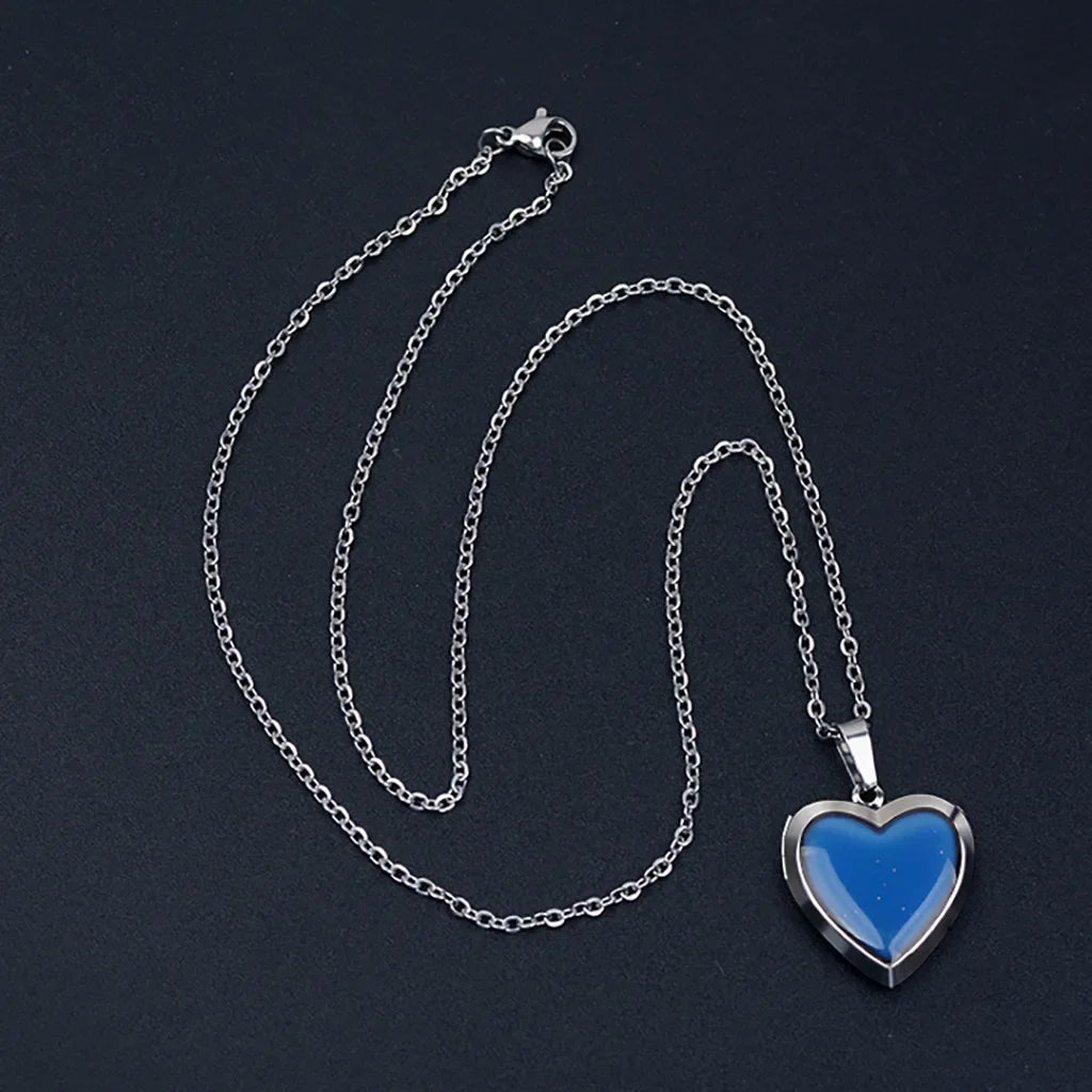 Heart-shaped mood locket necklace by HSF Marketplace with color-changing temperature-sensitive stainless steel pendant.