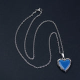 Heart-shaped mood locket necklace by HSF Marketplace with color-changing temperature-sensitive stainless steel pendant.