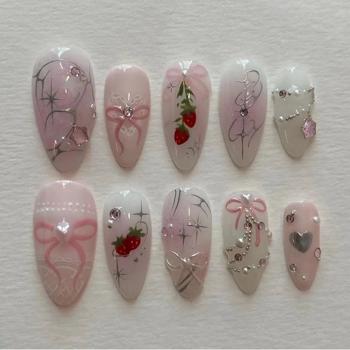 24-piece pink almond press-on false nails with bowknots, love hearts, and pearl design by HSF Marketplace