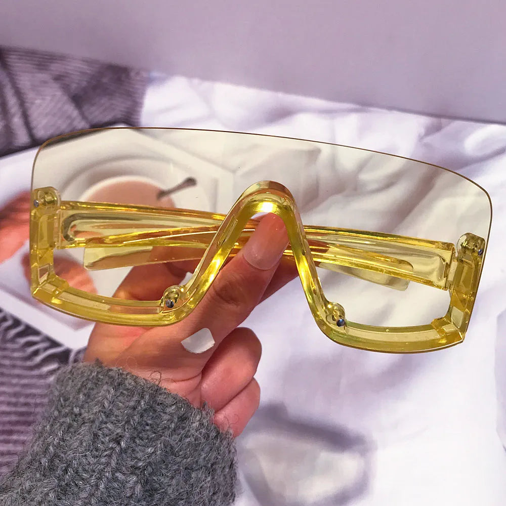 Candy color oversized one-piece shield sunglasses in red and yellow, trendy women's fashion sunglasses with bold, sexy hip hop style.