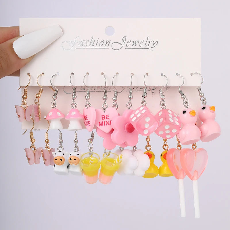 Cute cartoon duck dangle earrings set for girls, featuring playful yellow duck charms on hooks