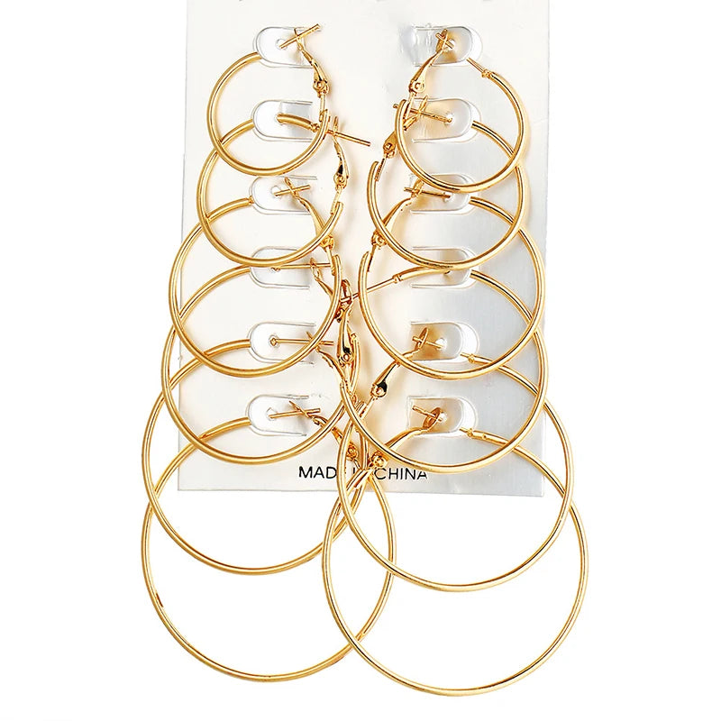 Set of 12 or 6 punk-style hoop earrings featuring large round oversized jewelry for women and girls, in silver tone.