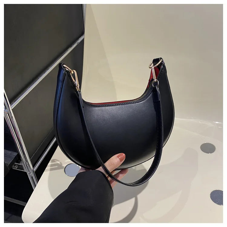 Luxury moon-shaped women's handbag by HSF Marketplace, elegant single shoulder purse with high-end fashion design and stylish details.