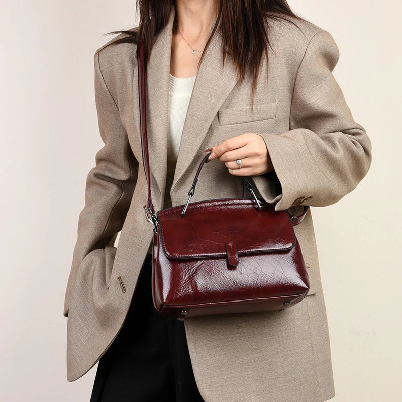 Elegant black leather small handbag for women with a shoulder strap, designer-style crossbody bag from HSF Marketplace.