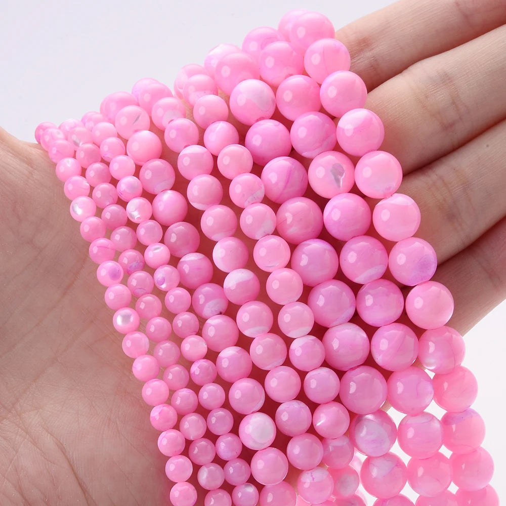 Natural freshwater shell pearls beads for jewelry making, shown as loose bead strands with a smooth pearlescent finish