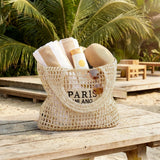 Handwoven straw beach tote bag for women with mesh hollow design, perfect for summer holidays and beach outings.