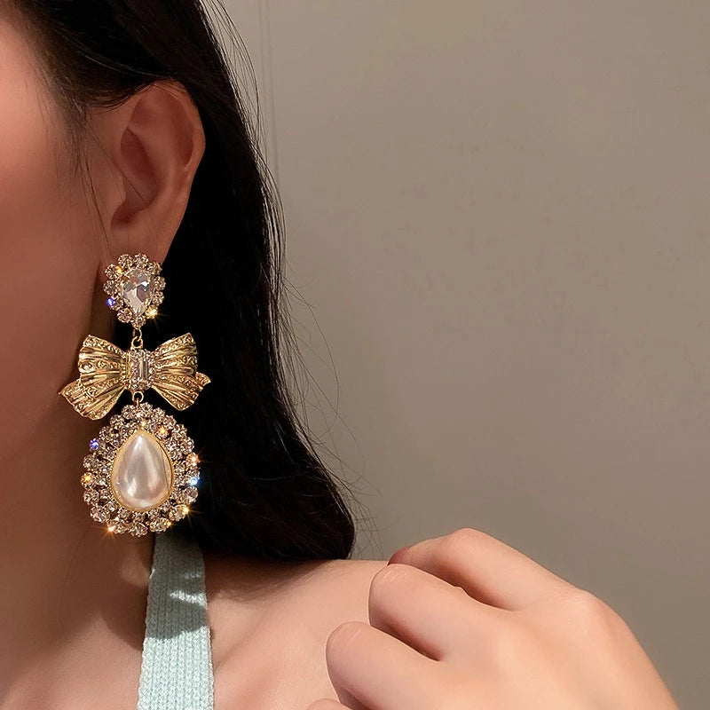 Elegant vintage gold bowknot dangle earrings for women by HSF Marketplace