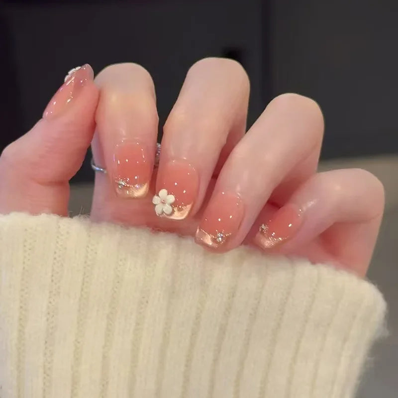 24-piece cute girly short square false nails with white French tips, glitter stars, rhinestones, bows, and cat-eye accents