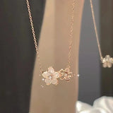 Elegant zircon cherry blossom necklace for women, featuring delicate floral design and fashion jewelry for special occasions.