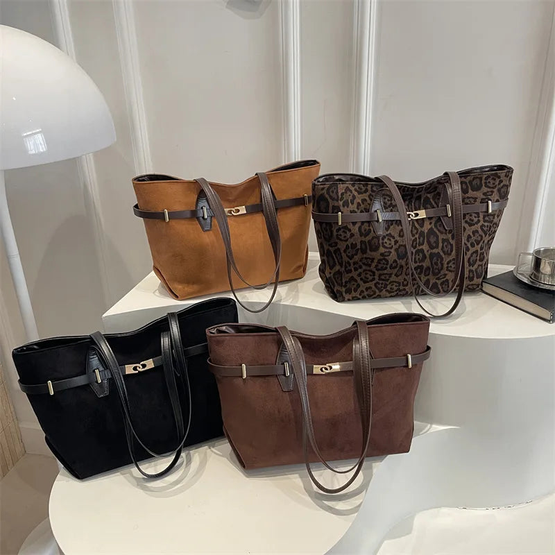 Leopard print shoulder tote bag with brown faux leather trim, gold lock detail, spacious handbag for women’s work and daily use.