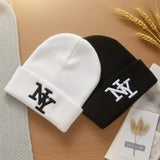 Unisex winter beanie hat with solid color 3D embroidery, knitted design for warm outdoor wear