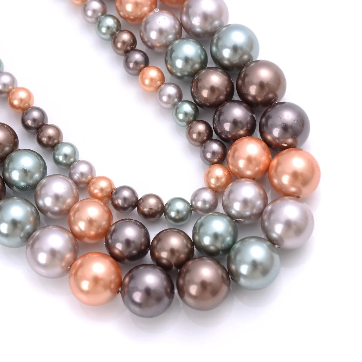 Natural freshwater shell pearls beads for jewelry making, displayed as hair styling tools