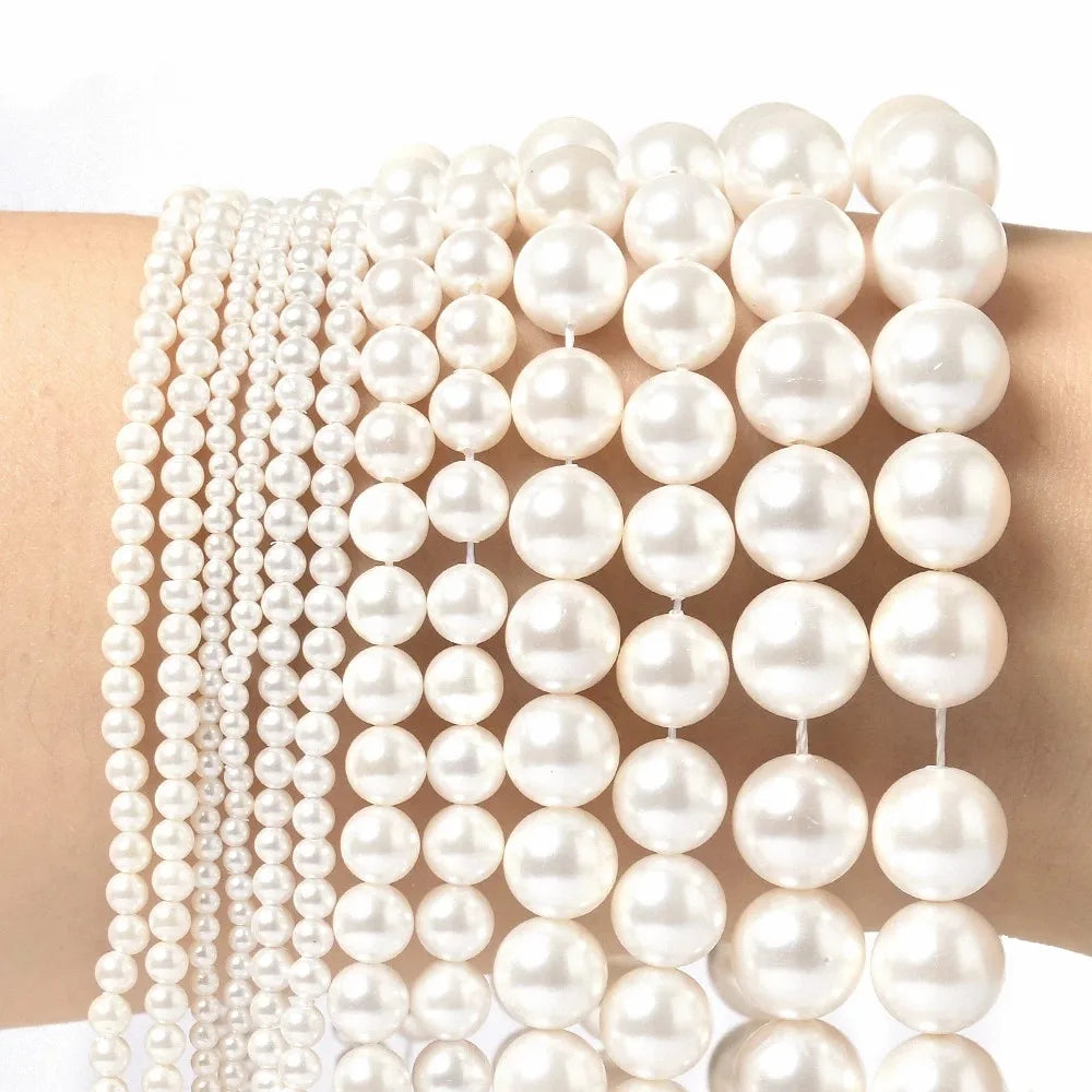 Natural freshwater shell pearls beads for jewelry making, displayed as loose white pearl beads
