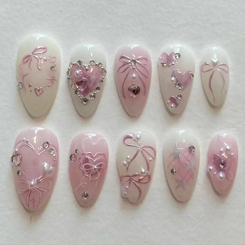 24-piece pink almond press-on false nails with bowknot, love heart, and pearl designs by HSF Marketplace