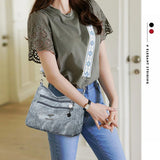 Spacious women's multi-pocket shoulder purse with vintage soft leather, ethnic pattern strap, ideal for everyday use.