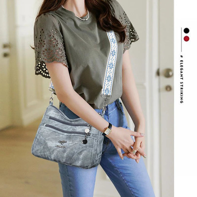 Spacious women's multi-pocket shoulder purse with vintage soft leather, ethnic pattern strap, ideal for everyday use.
