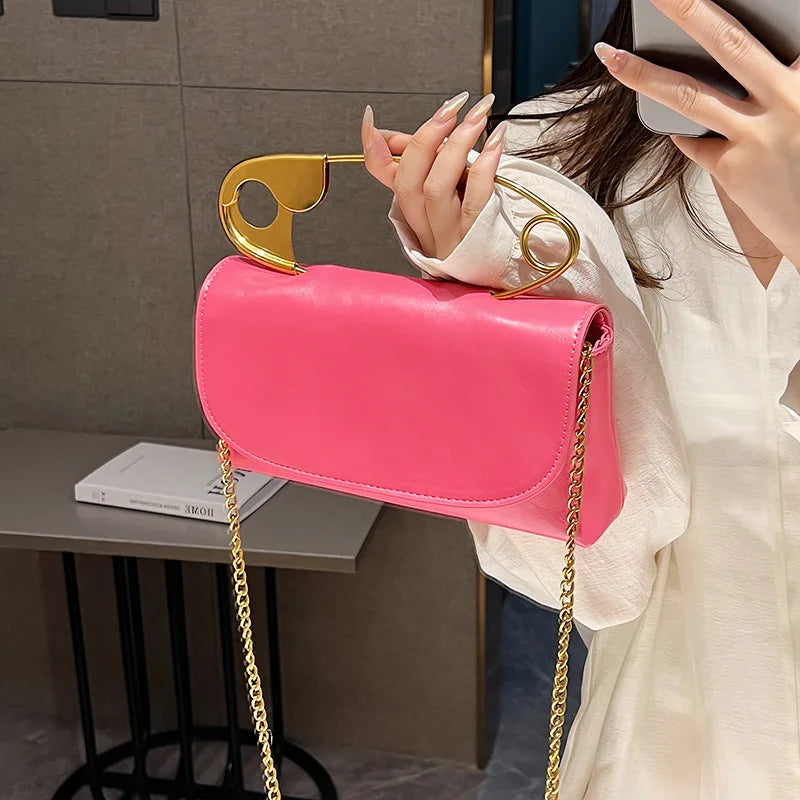 Red retro metal pin design crossbody bag for women, PU leather handbag with chain strap, stylish clutch and purse from HSF Marketplace.