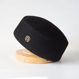 Women's vintage wool felt beret hat with hard concave top, pillbox fascinator style for weddings and parties
