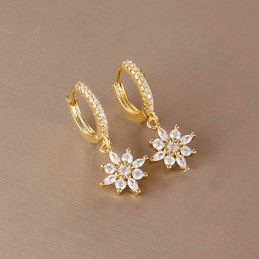Stainless steel star dangle earrings with sparkling zircon accents by HSF Marketplace